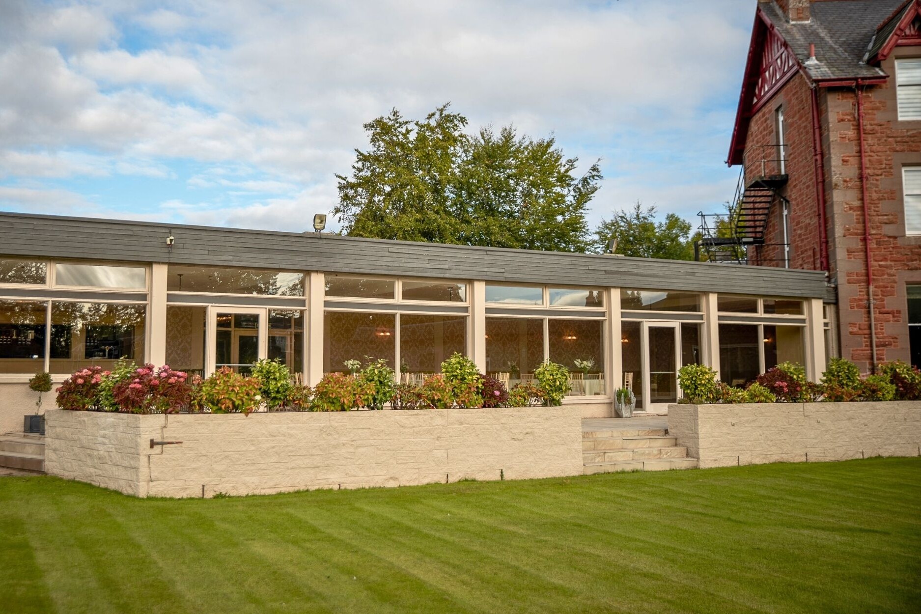 outside shot of modern glass function suite extension
